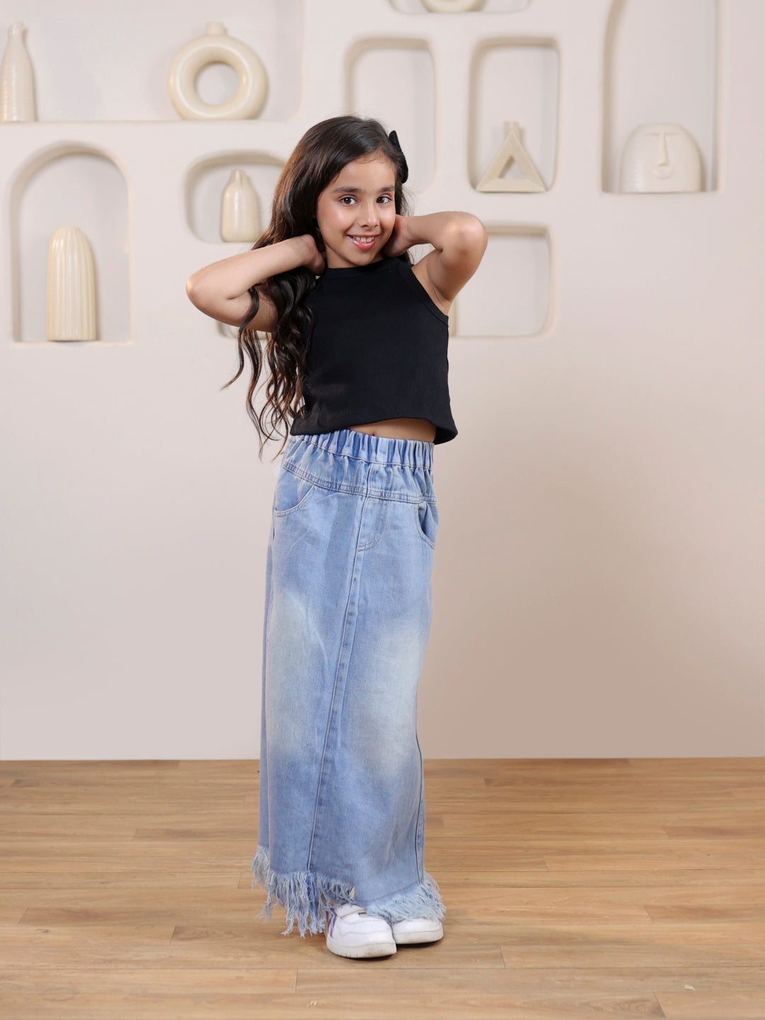 Ribbed sleeveless crop top and distressed faded straight maxi denim skirt