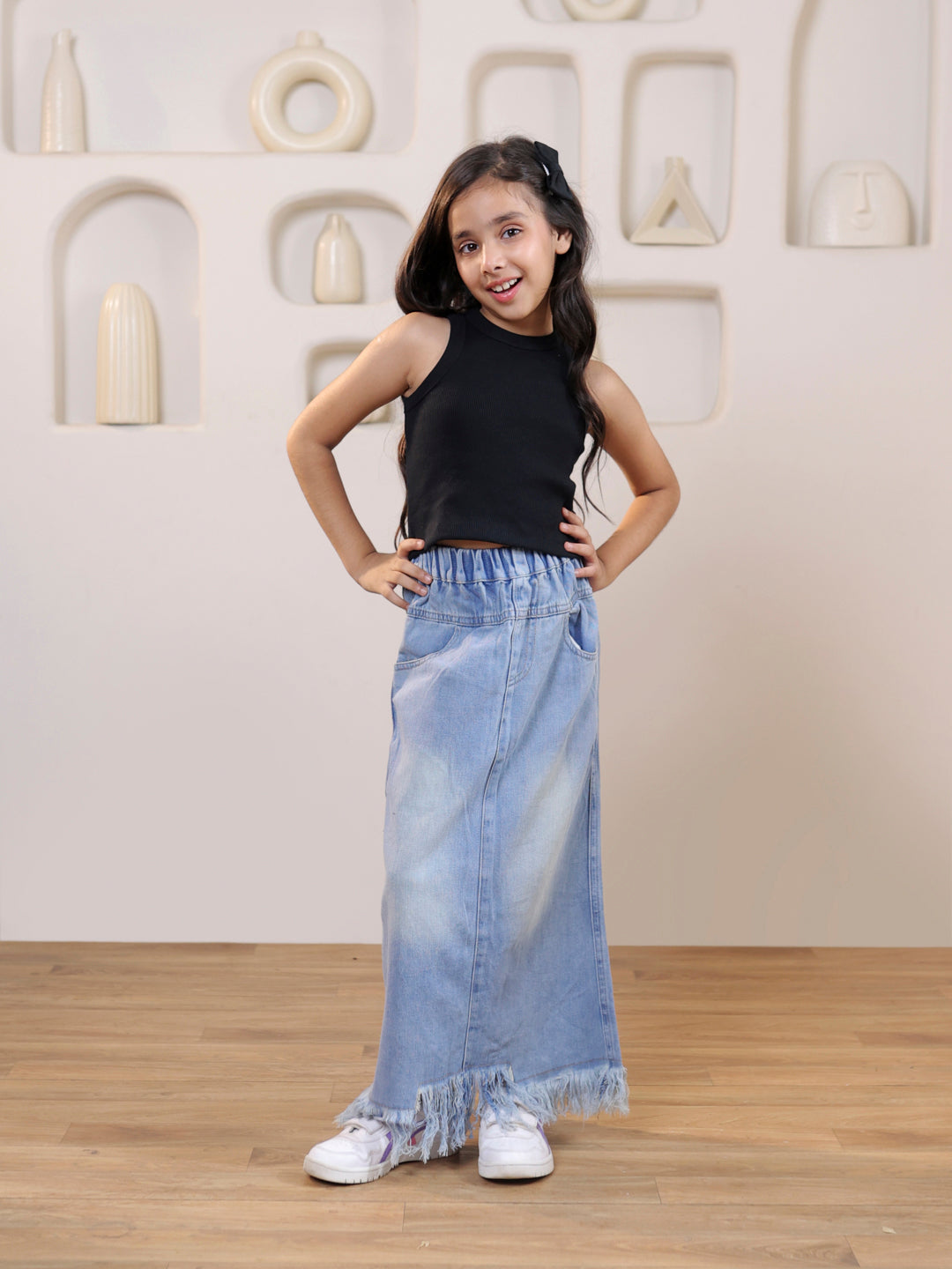 Ribbed sleeveless crop top and distressed faded straight maxi denim skirt