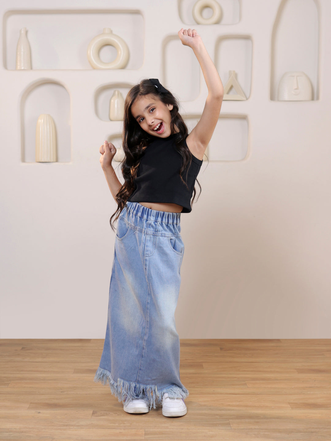 Ribbed sleeveless crop top and distressed faded straight maxi denim skirt