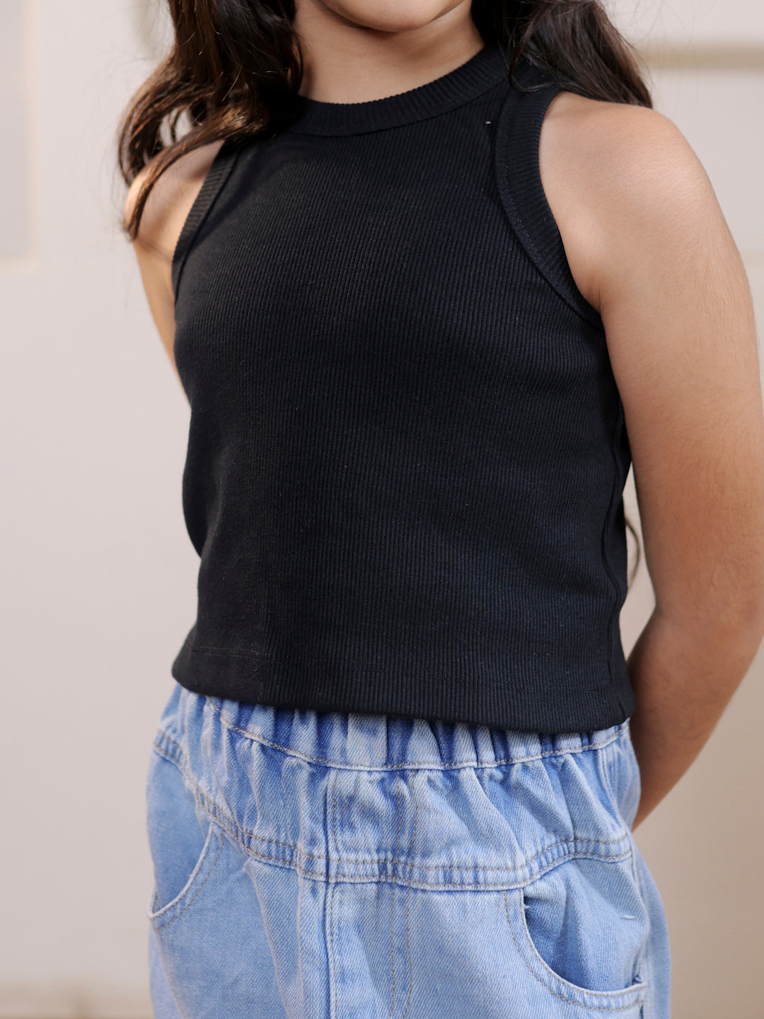 Ribbed sleeveless crop top and distressed faded straight maxi denim skirt