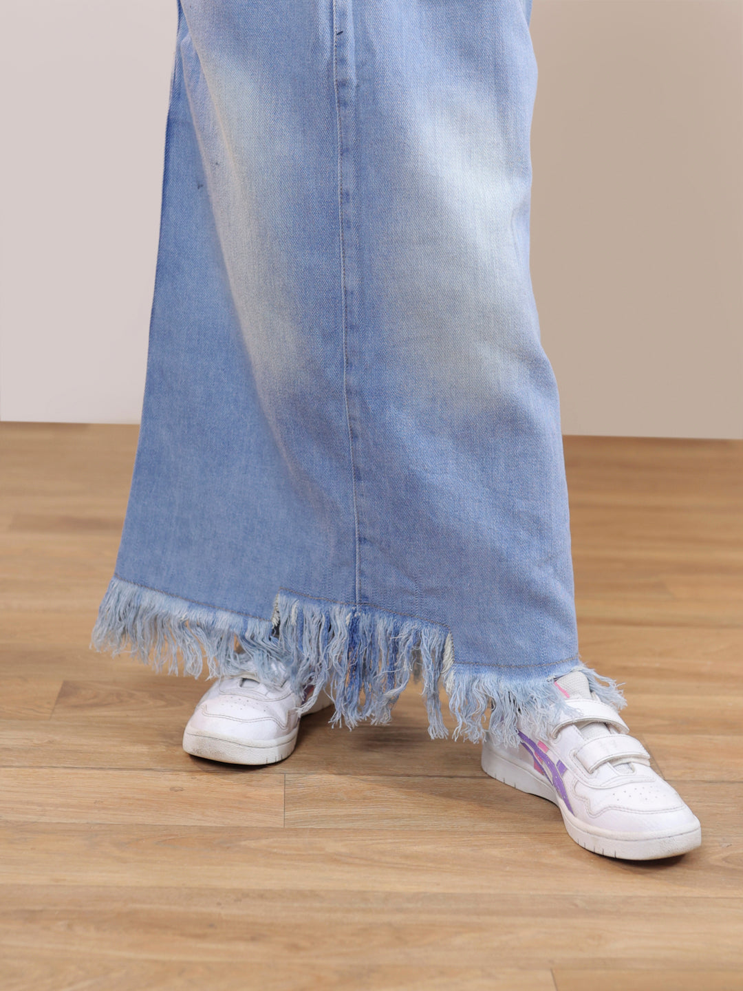 Ribbed sleeveless crop top and distressed faded straight maxi denim skirt