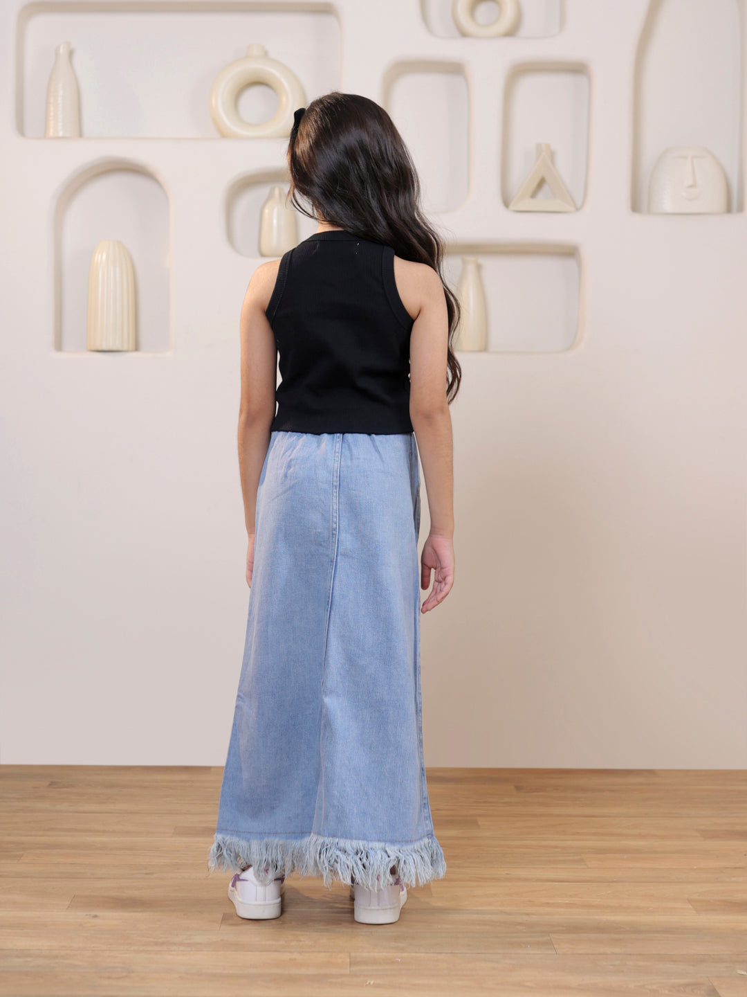 Ribbed sleeveless crop top and distressed faded straight maxi denim skirt
