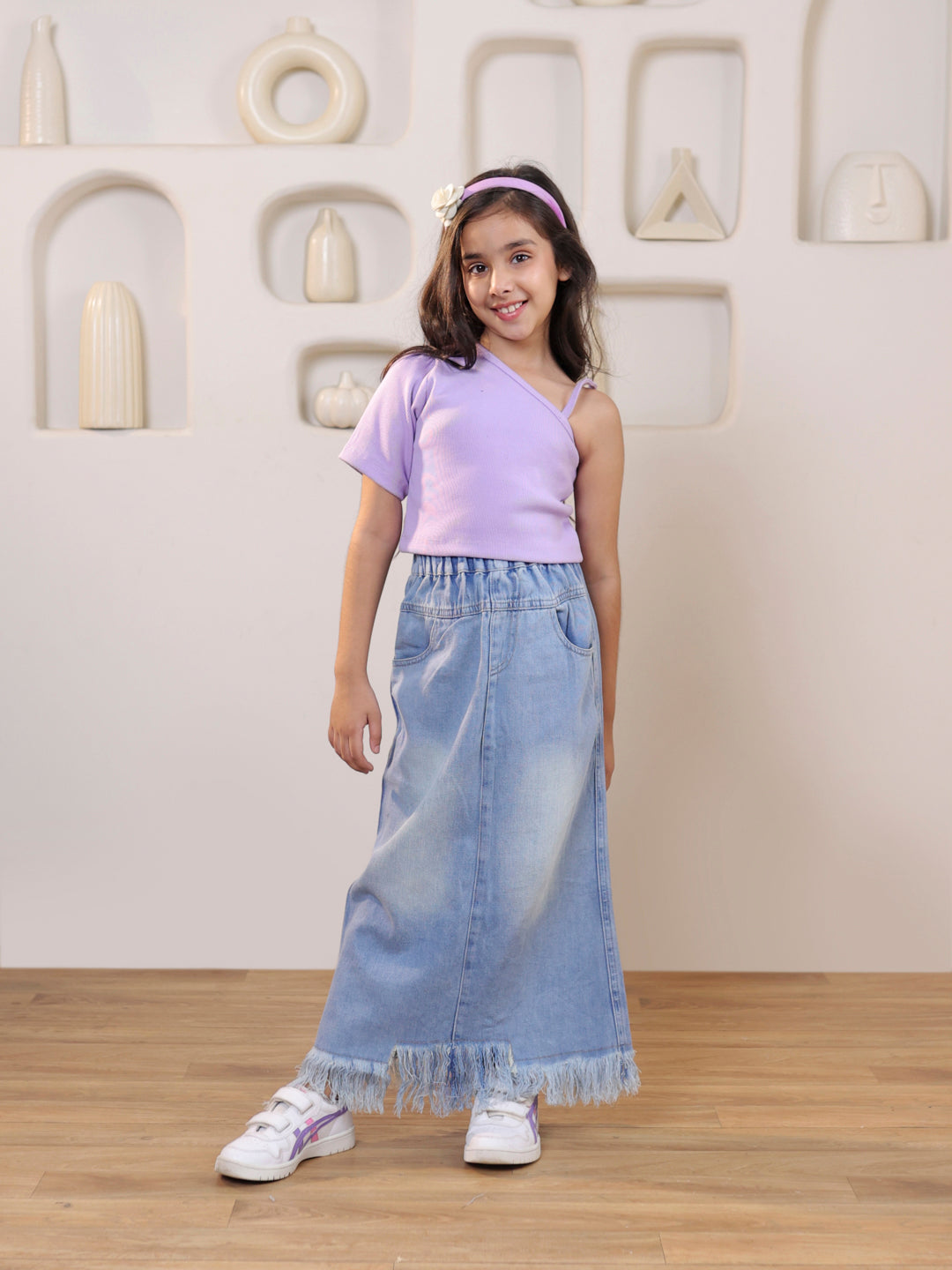 Ribbed one shoulder top and distressed faded straight maxi denim skirt