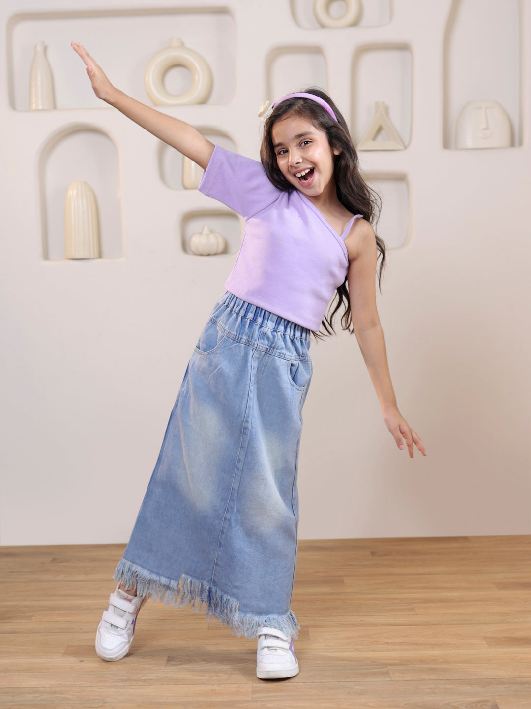 Ribbed one shoulder top and distressed faded straight maxi denim skirt