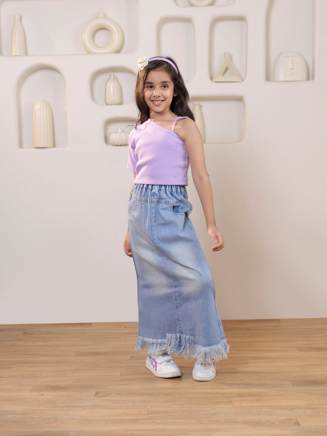 Ribbed one shoulder top and distressed faded straight maxi denim skirt
