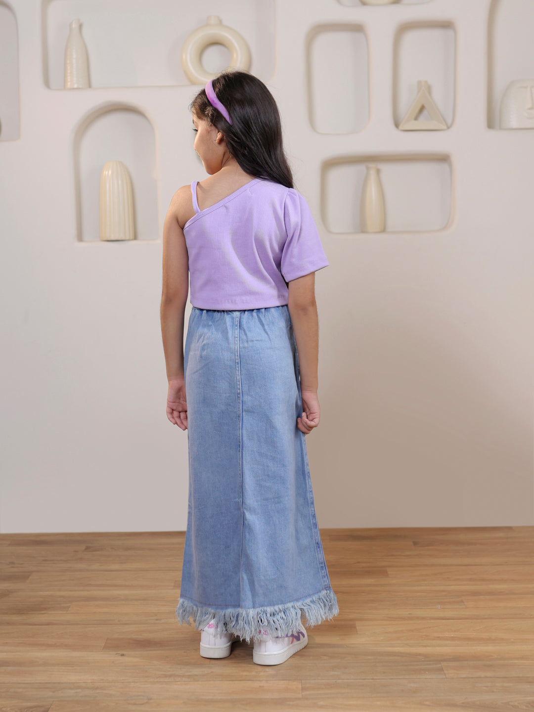 Ribbed one shoulder top and distressed faded straight maxi denim skirt